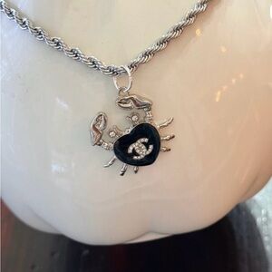 Chanel Silver-Tone stamped 
Crab in black enamel & Chrystal 
on 19" twist rope